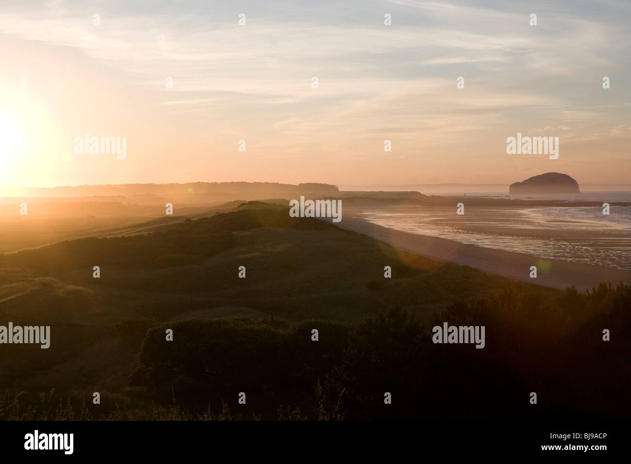 scottish coastline at sunrise with flare Stock Photo