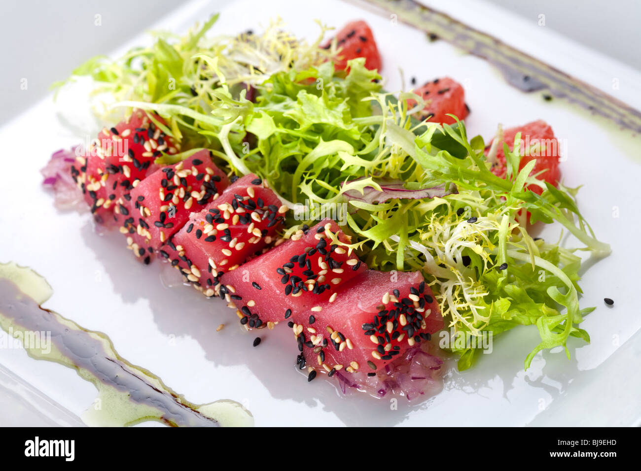 Raw fish tuna with salad frieze Stock Photo