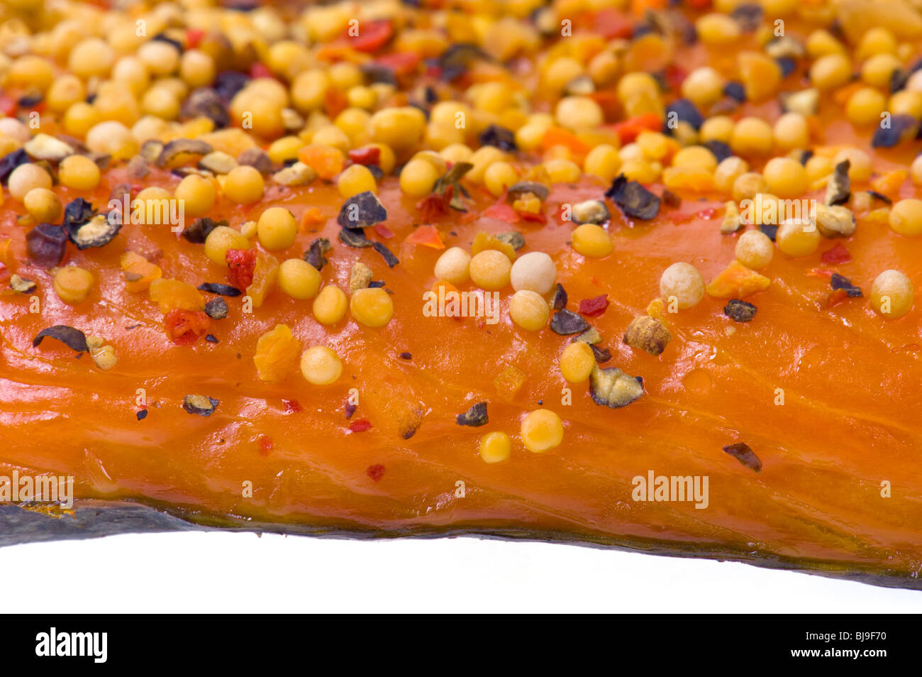 Stremel-salmon Stremel hot smoked pieces of salmon fish fillet with peppers and spices pepper paprika onion mustard seed smoke s Stock Photo