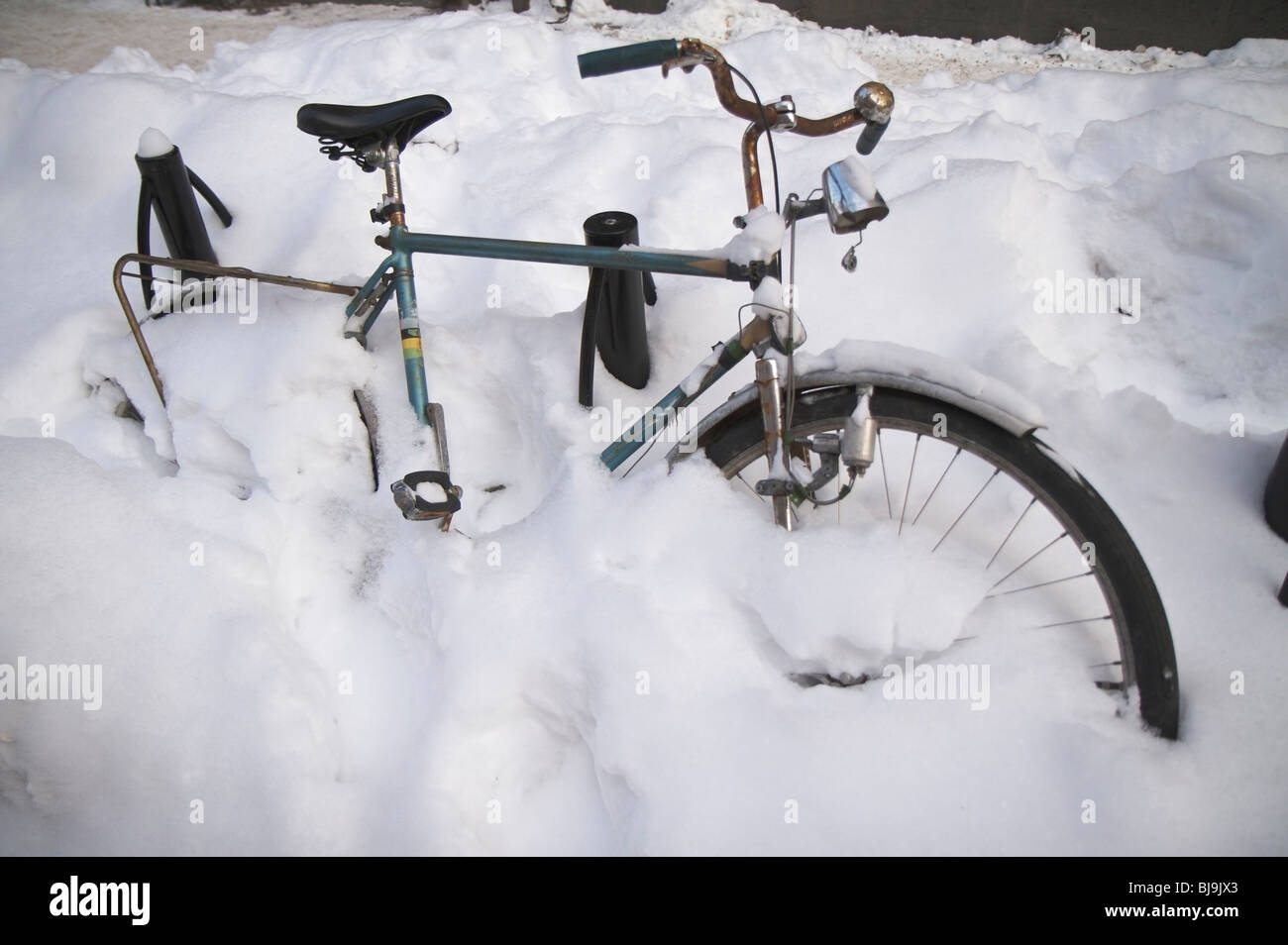 Bikes covered in snow Stock Photo