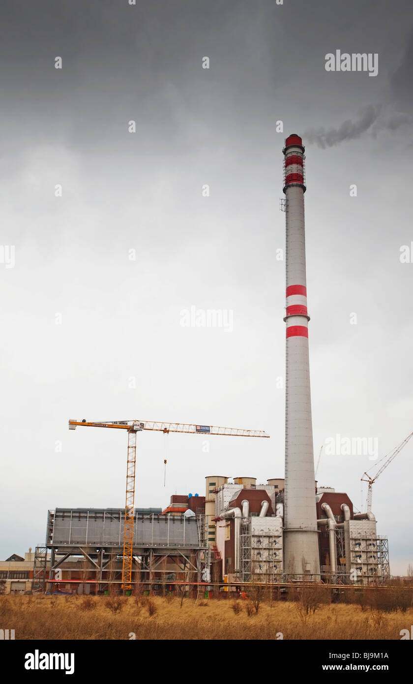 Factory smokestack emitting smoke in nonurban landscape Stock Photo Alamy