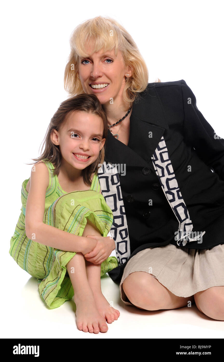 Mother and daughter smiling isolated over white background Stock Photo ...