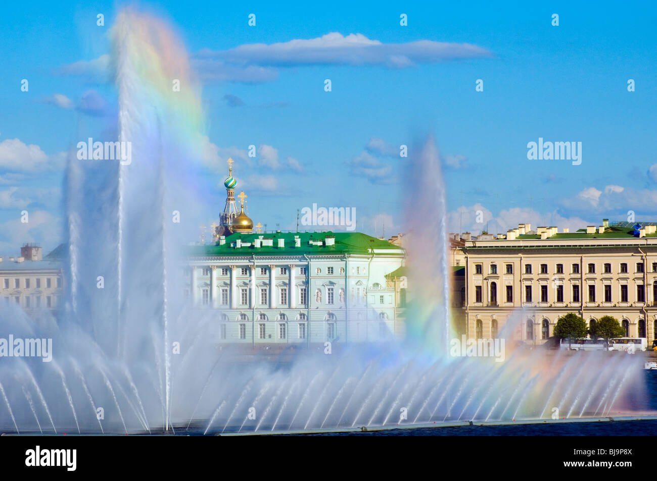 Fountains in the River Neva, St Petersburg, Russia, with buildings of the Hermitage Museum behind Stock Photo