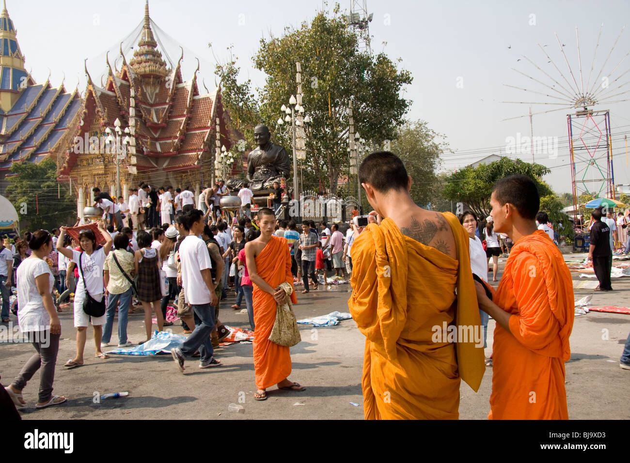 Tattooed monks and devotees at Wat Bang Phra, a Buddhist temple in Thailand  where monks tattoo devotees Stock Photo - Alamy