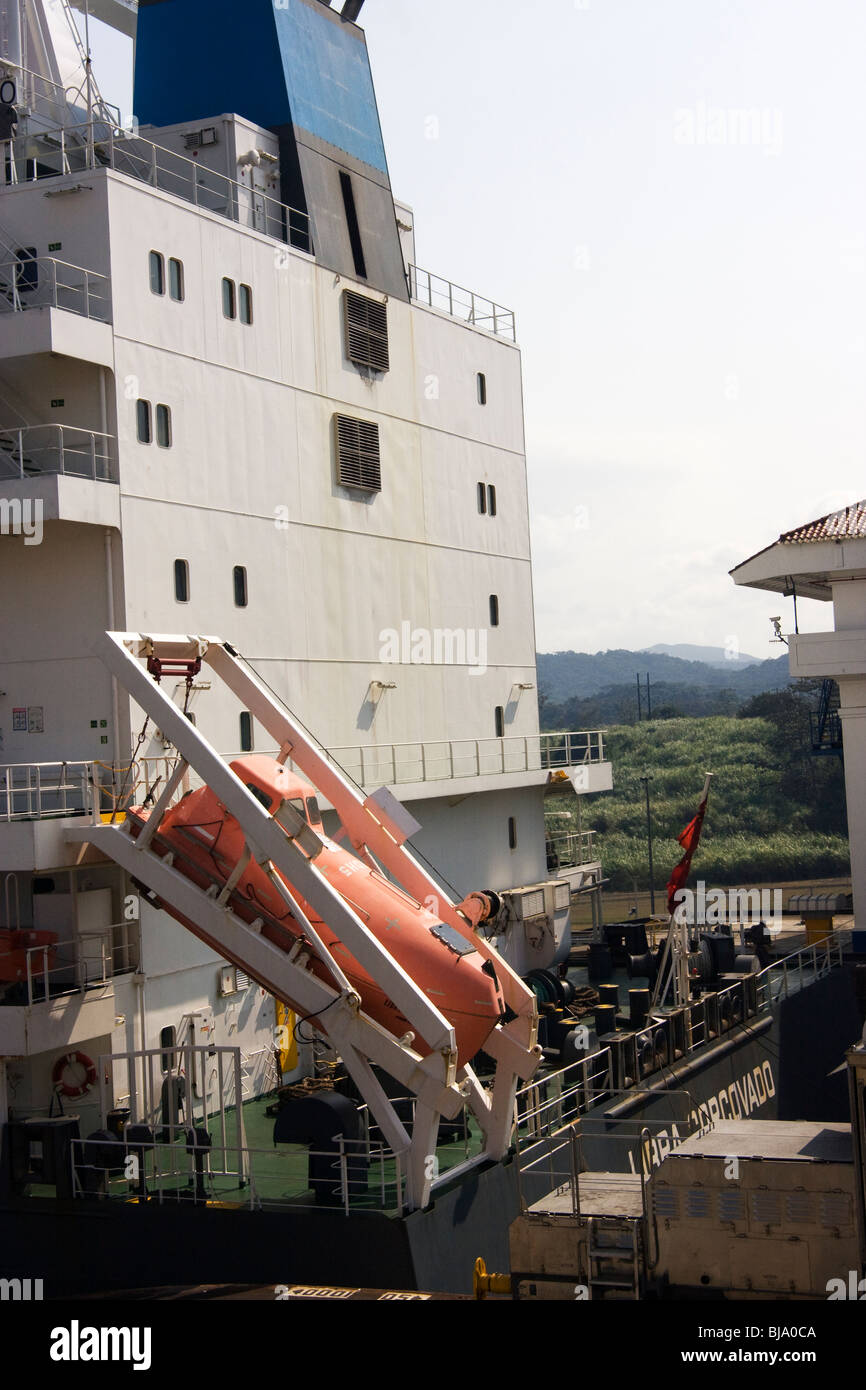 Escape pod or free-fall lifeboat on the back of a container ship Stock Photo