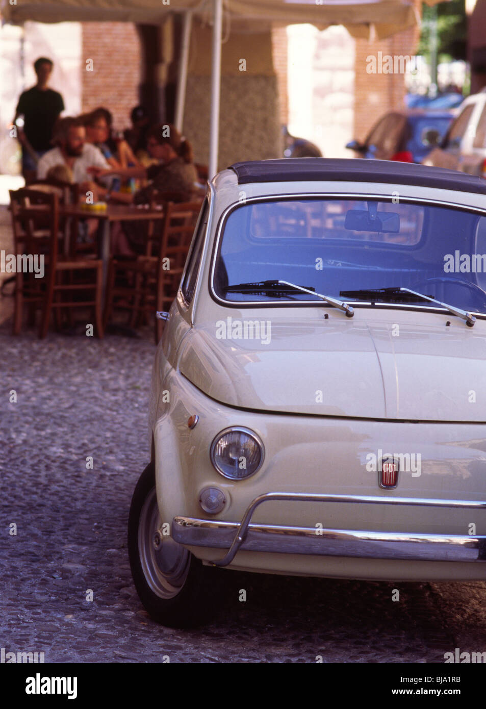 Fiat 500 on quaint cobble-stoned alleyway in Verona, Italy. Stock Photo