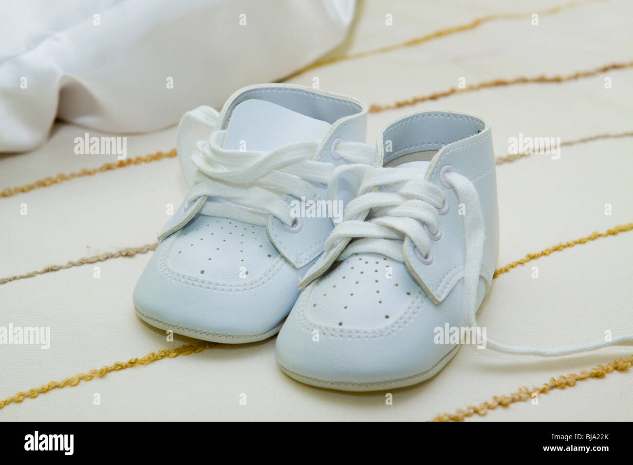 Baby boy shoes for Christening Stock Photo Alamy