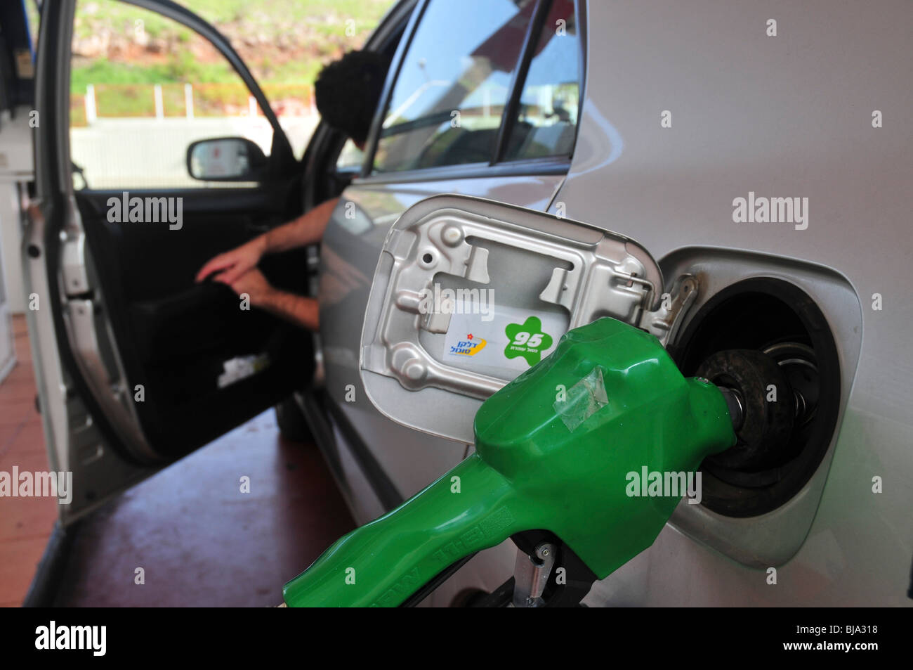 filling up unleaded petrol at a petrol station Stock Photo