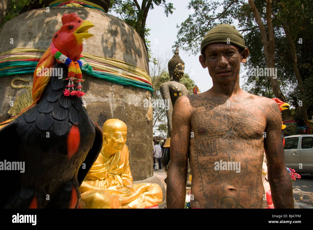 A young man´s sacred full-body tattoos at Wat Bang Phra temple in Thailand,  where monks tattoo their devotees with prayers Stock Photo - Alamy