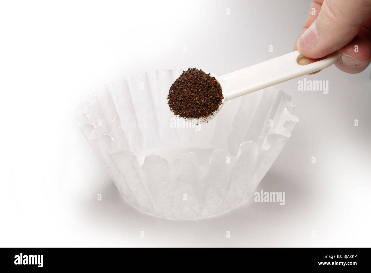 Measuring coffee into a filter Stock Photo Alamy