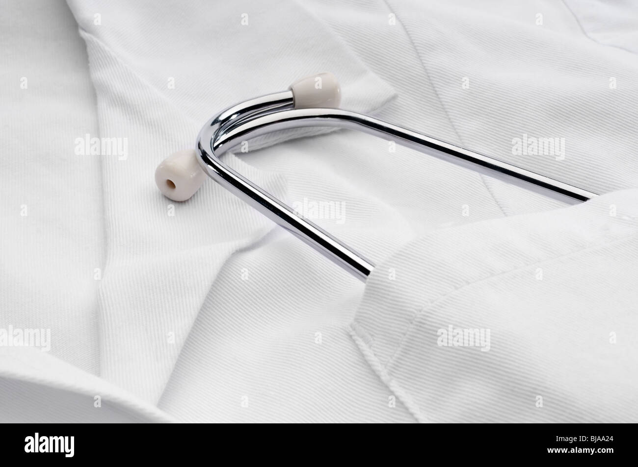 A stethoscope in the pocket of a doctor's white medical lab coat Stock Photo