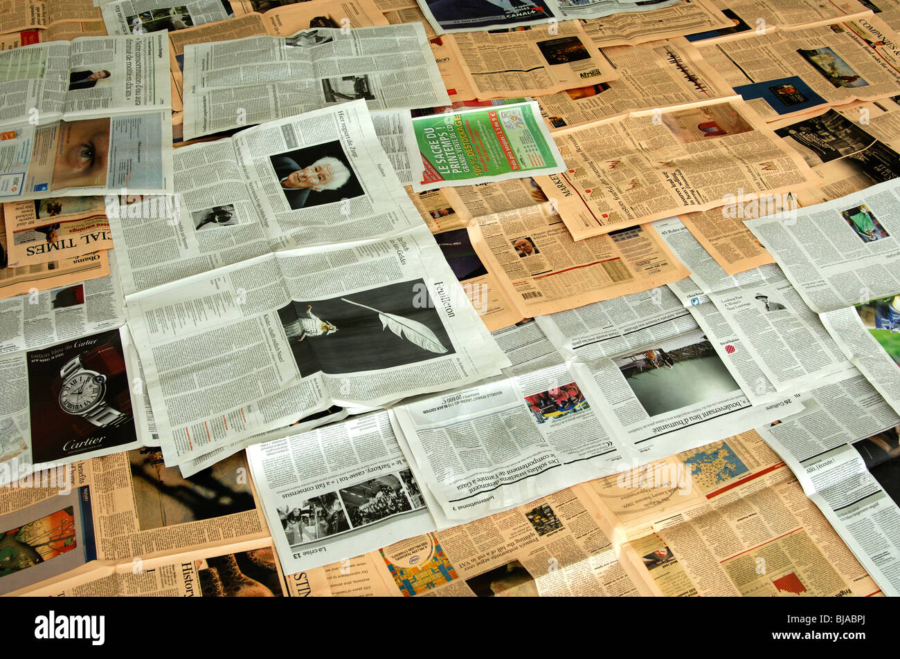 Laid-out pages of diverse newspapers Stock Photo