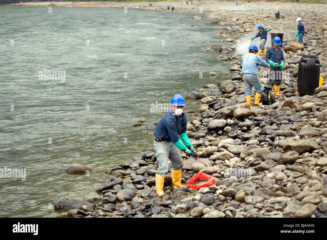 Cleaning up an oil spill on an Amazonian river Stock Photo