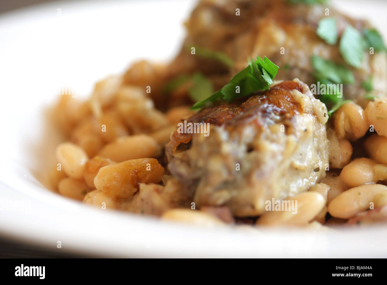 Authentic French Style Rich Slow Cooked Pork Cassoulet Casserole With White Beans And No People Stock Photo