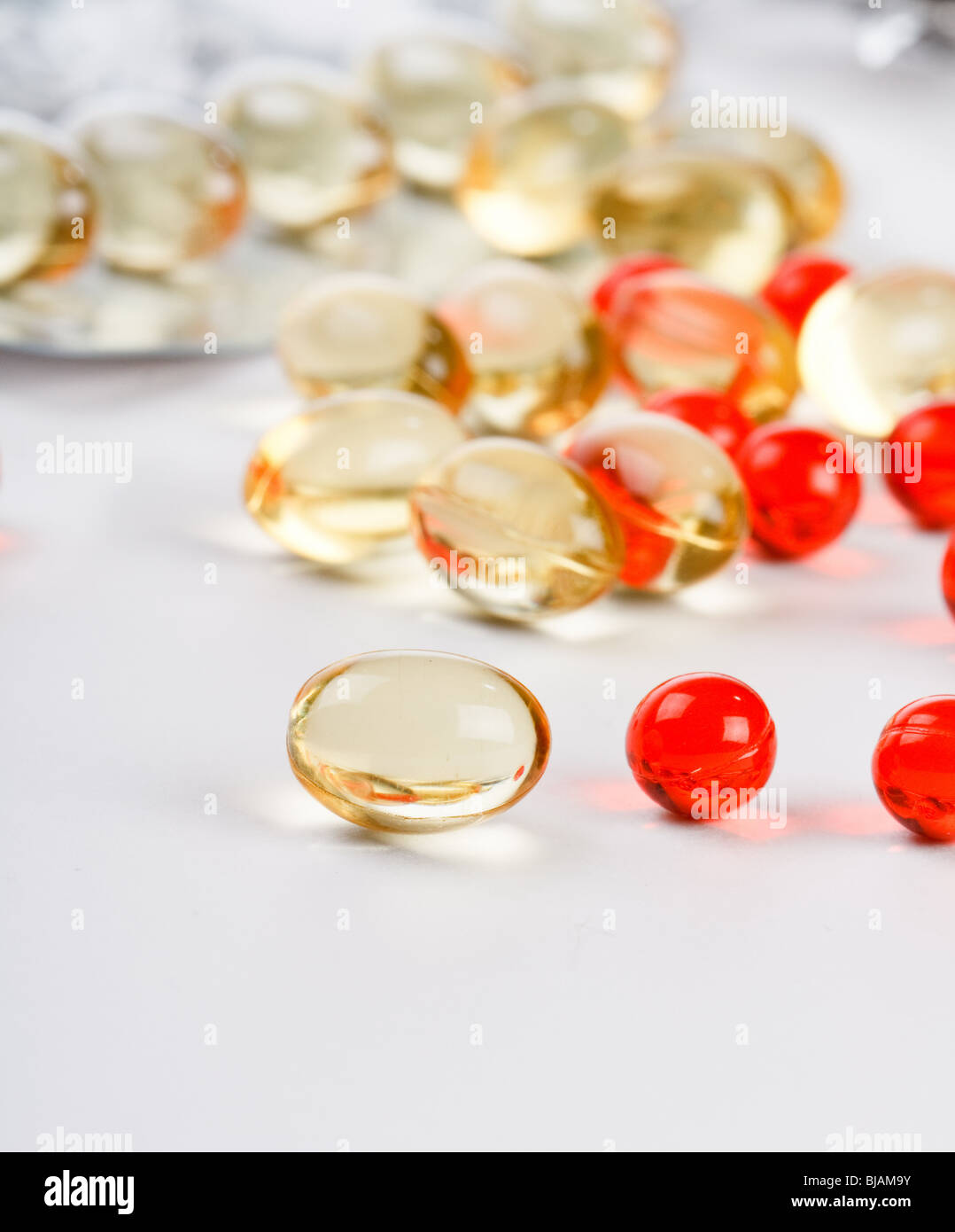 transparent pills of vitamin E Stock Photo