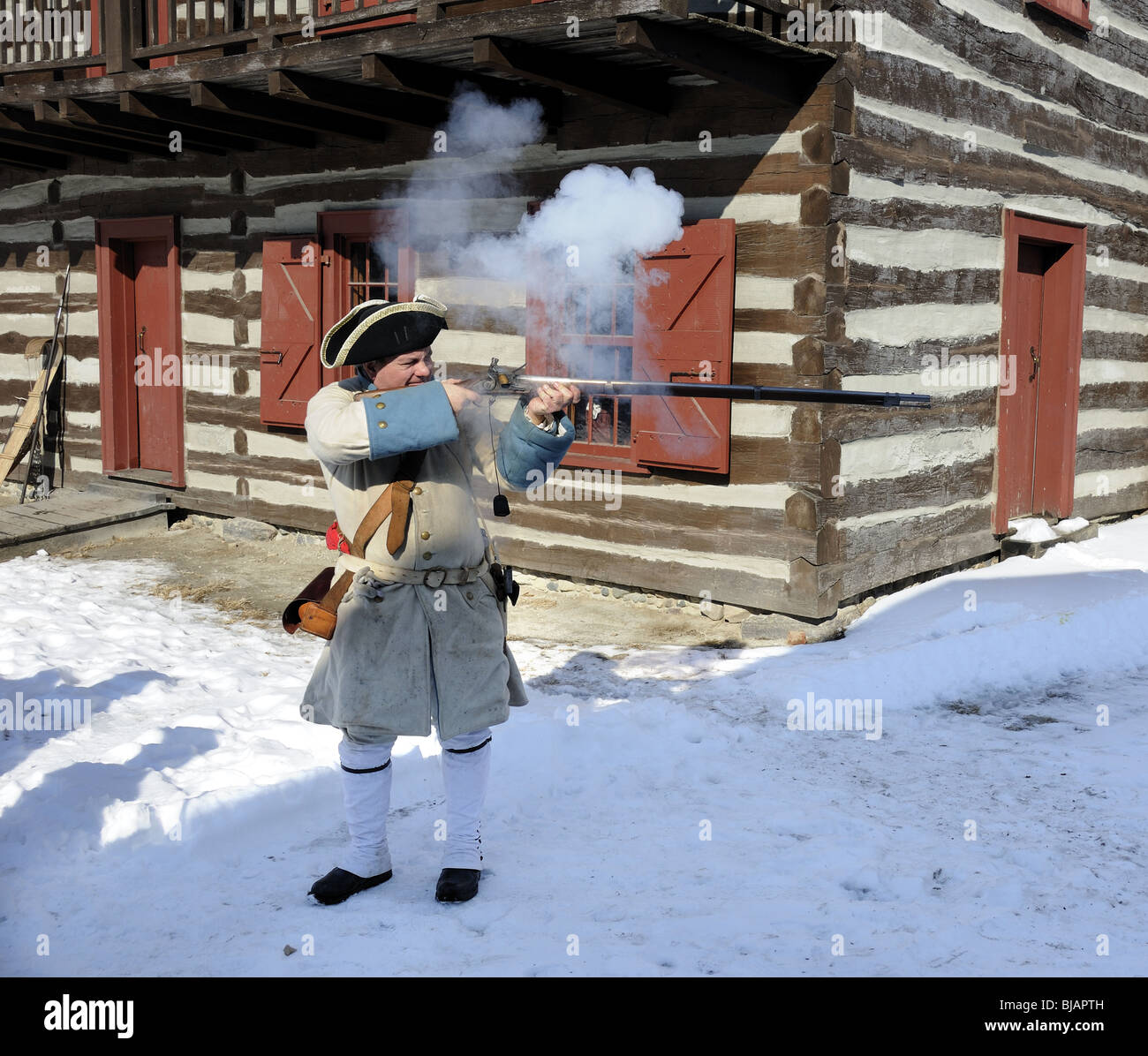 Revolutionary War Soldier fires his weapon Stock Photo