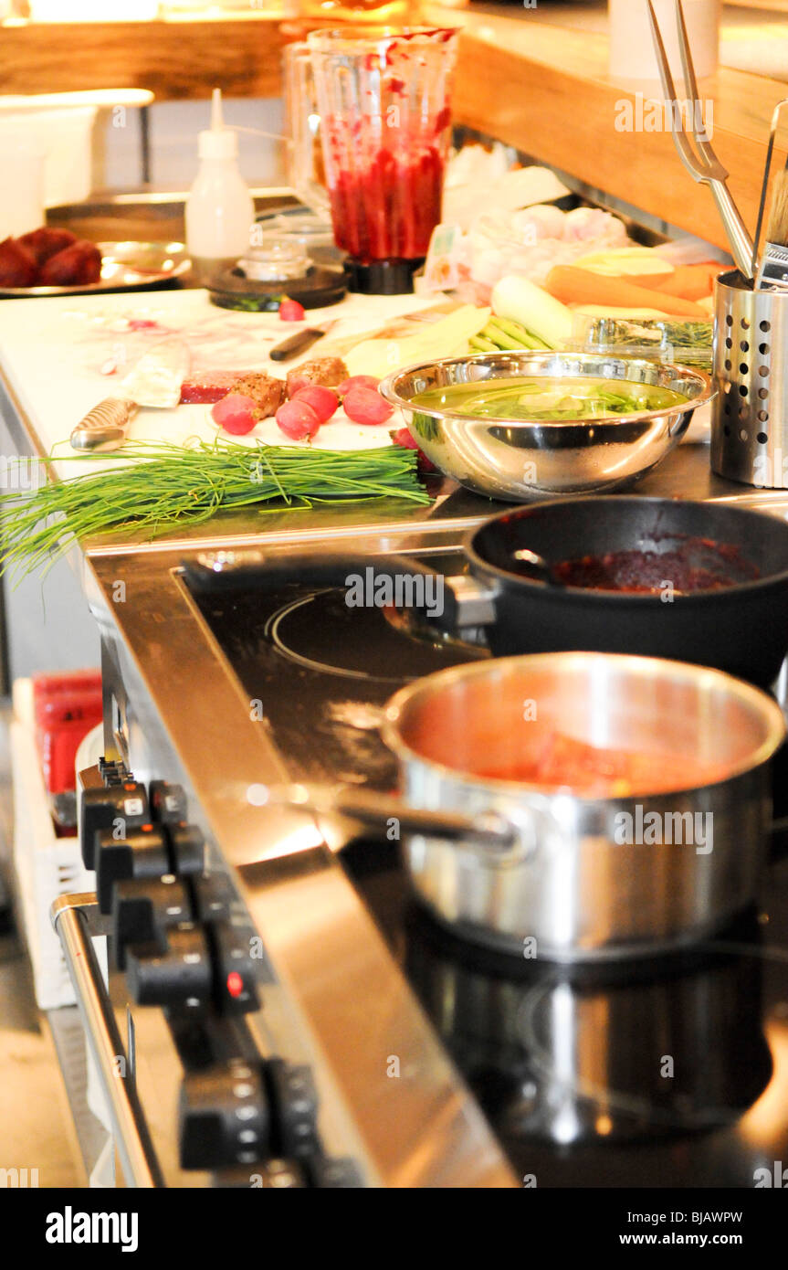 Kitchen in the process of preparing and cooking food Stock Photo - Alamy