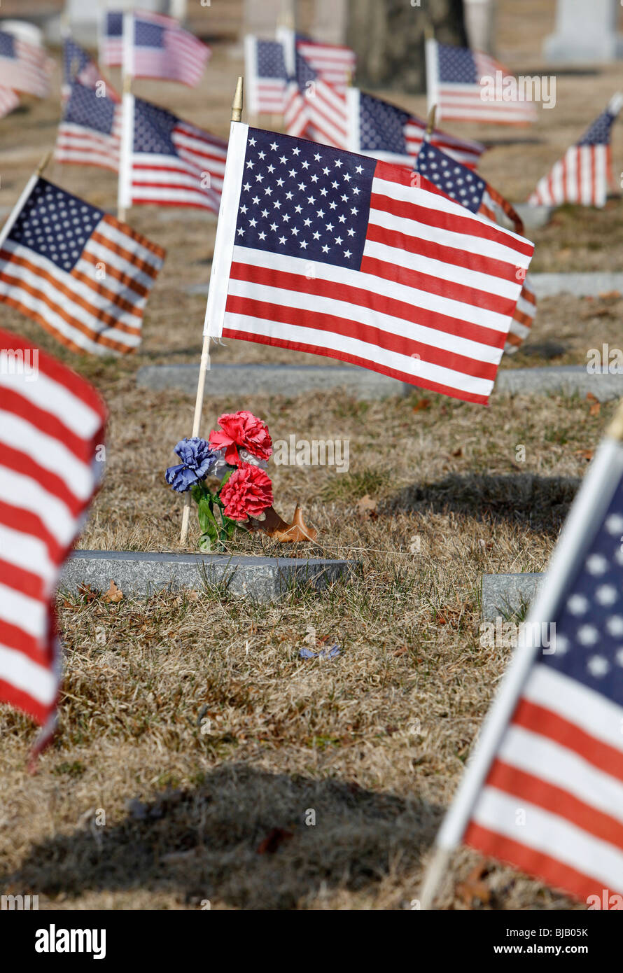 Unites States flags on grave sites at a military cemetery, Providence ...