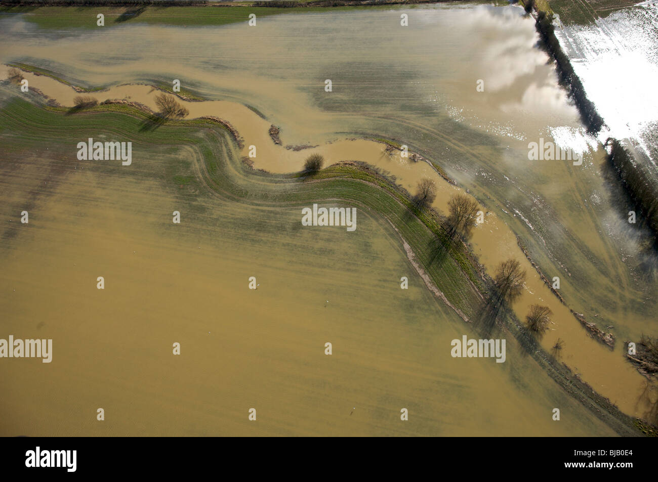 Aerial view of a river bursting it's banks. Stock Photo