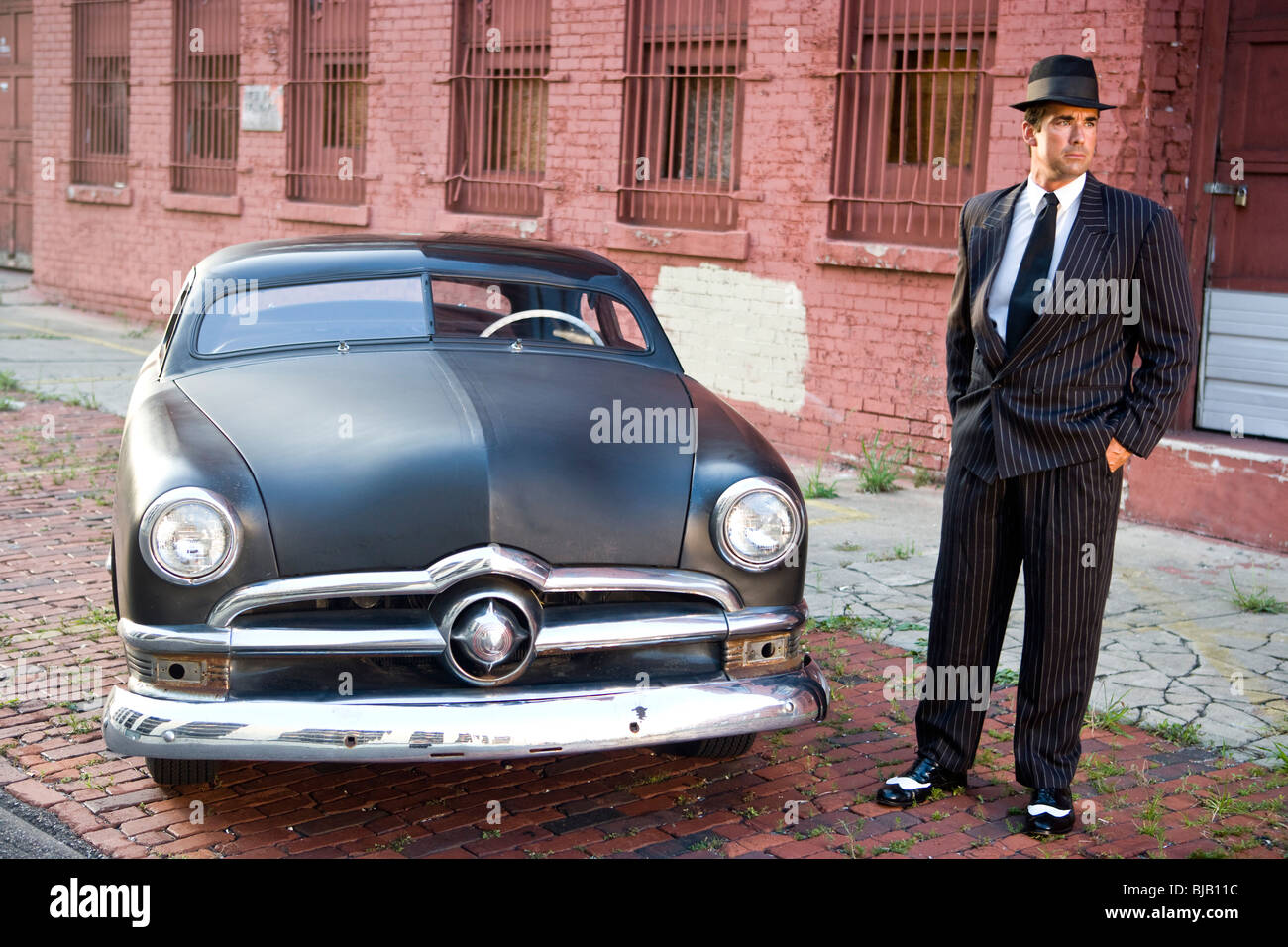 Man In Pinstripe Suit Standing Next To Vintage Car Stock Photo Alamy