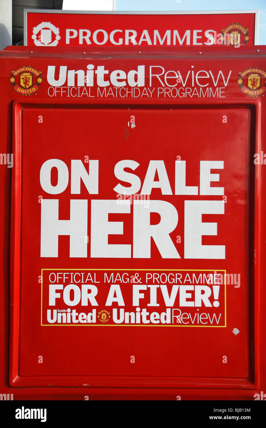 Notice on the side of a programme sellers stall outside Old Trafford football stadium, home ground of Manchester United. Stock Photo