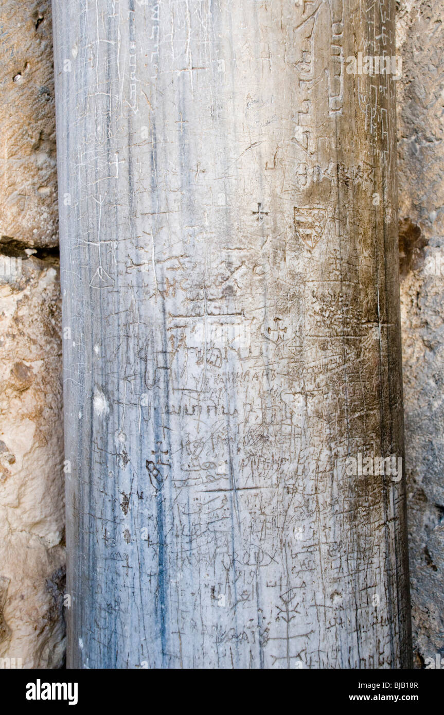 Israel, Jerusalem, Old City, Church of the Holy Sepulchre. Pilgrims engraved their mark at the entrance to the church Stock Photo