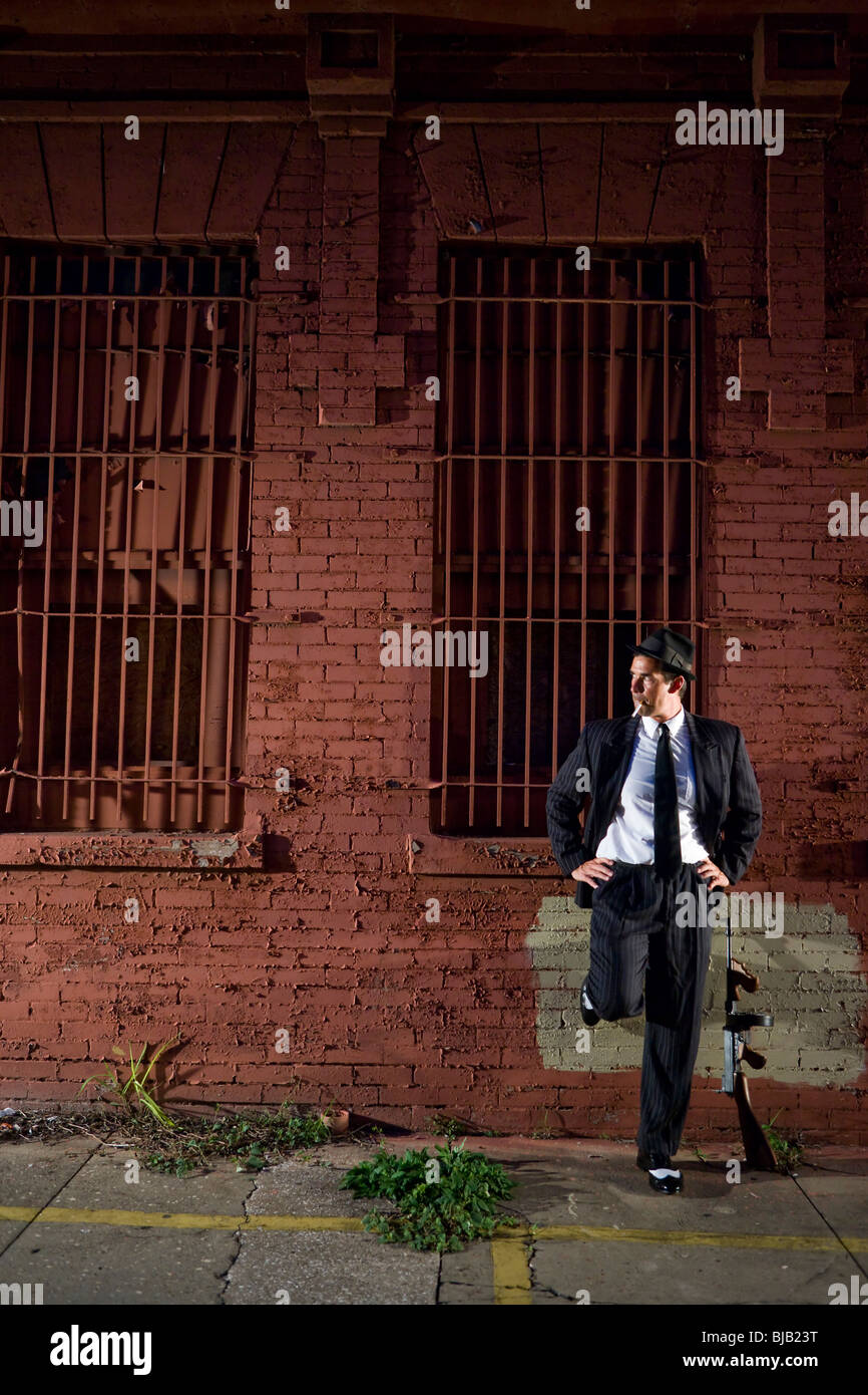 Gangster in dark pinstripe suit with Tommy gun Stock Photo Alamy