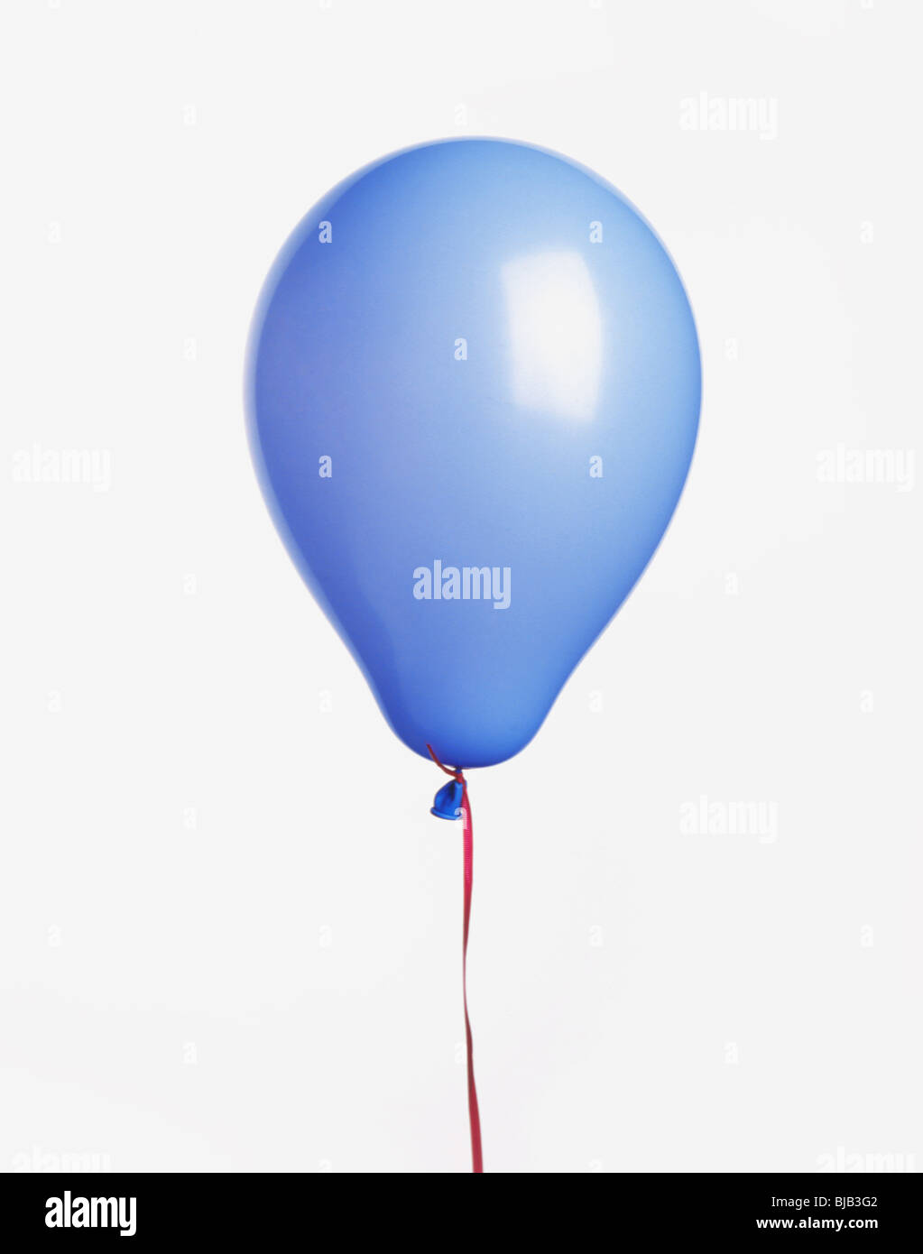 blue balloon with ribbon cut-out on white background Stock Photo