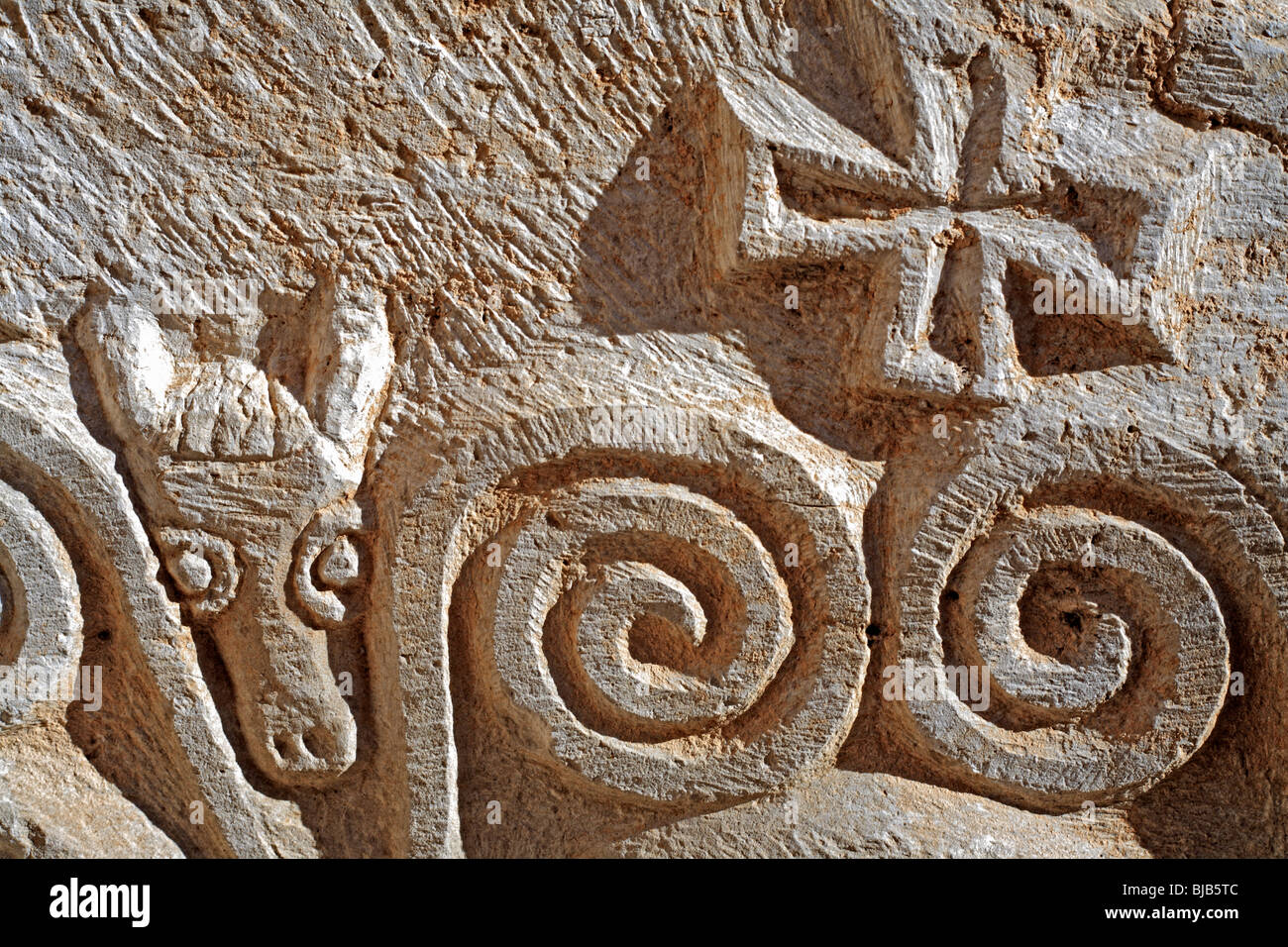 Relief on stone with lamb and cross, Madaba, Jordan Stock Photo