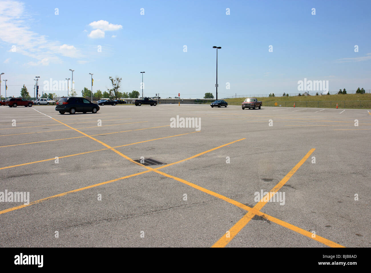 An almost empty supermarket car park with yellow lines, Kendallville