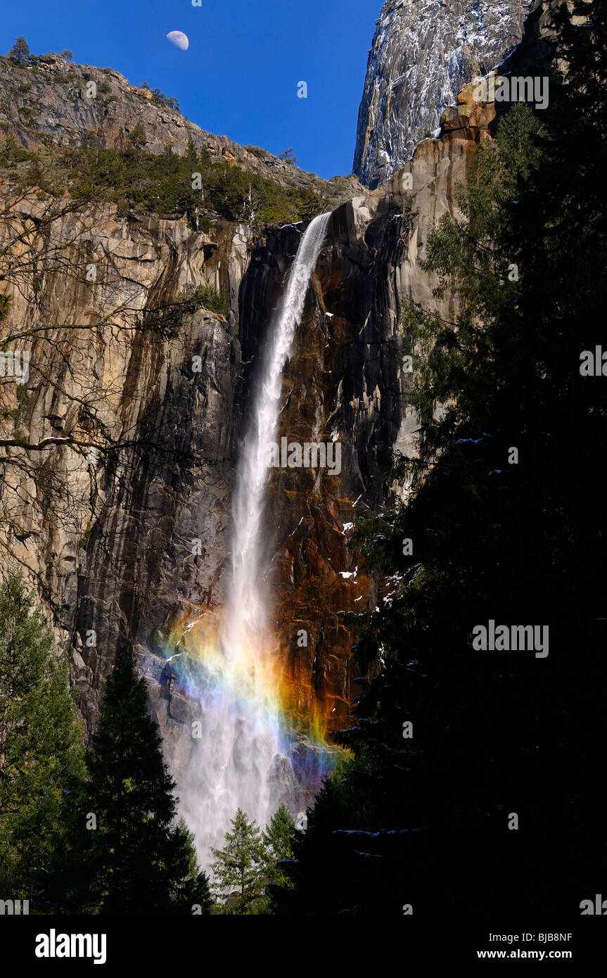 Rainbow In The Mist Of Bridalveil Fall Waterfalls At Cathedral Rocks With Half Moon Yosemite National Park California Usa Stock Photo Alamy