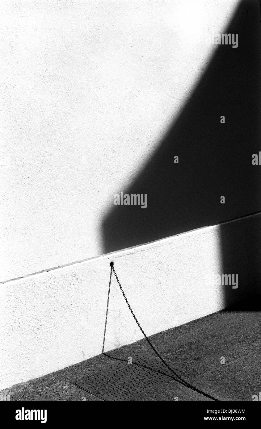 chain and wall shadows Stock Photo