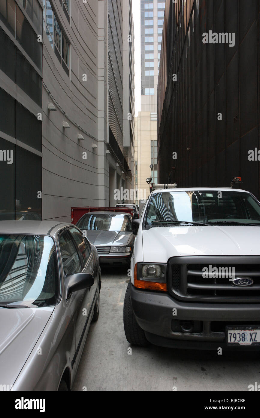 Tightly parked cars on a small street in Chicago Downtown, United
