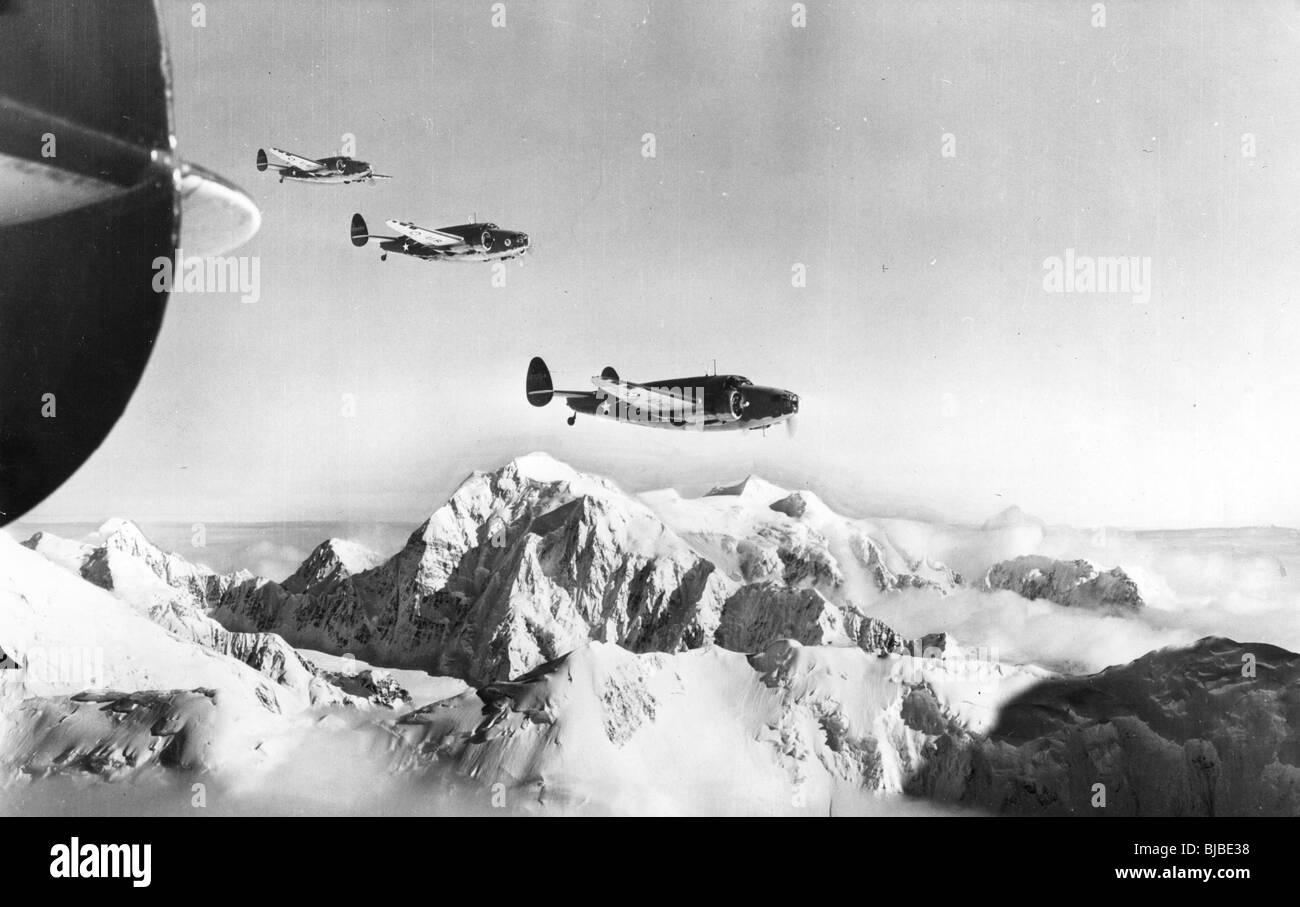 'Mt. McKinley, Alaska ... United States Army A-29s, attack bombers, are shown winging their way over snow capped Mt. McKinley Stock Photo