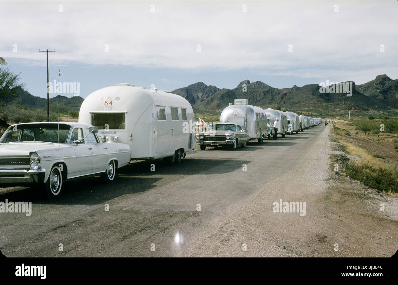 1960s cars pull Airstream camping trailers during the early 60s in the American Southwest. color horizontal travel Stock Photo