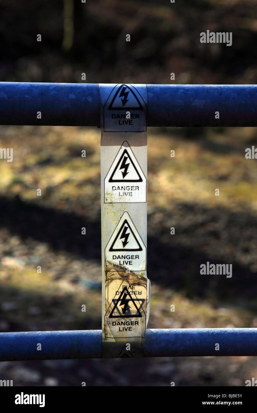 Electrified gate with danger Live signs Stock Photo