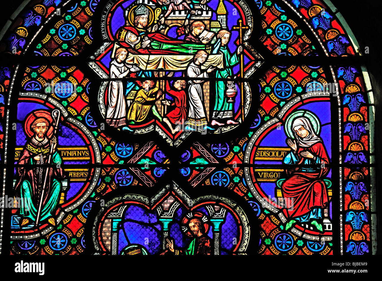 Romanesque coloured stained window, Glass painting in the church Sainte