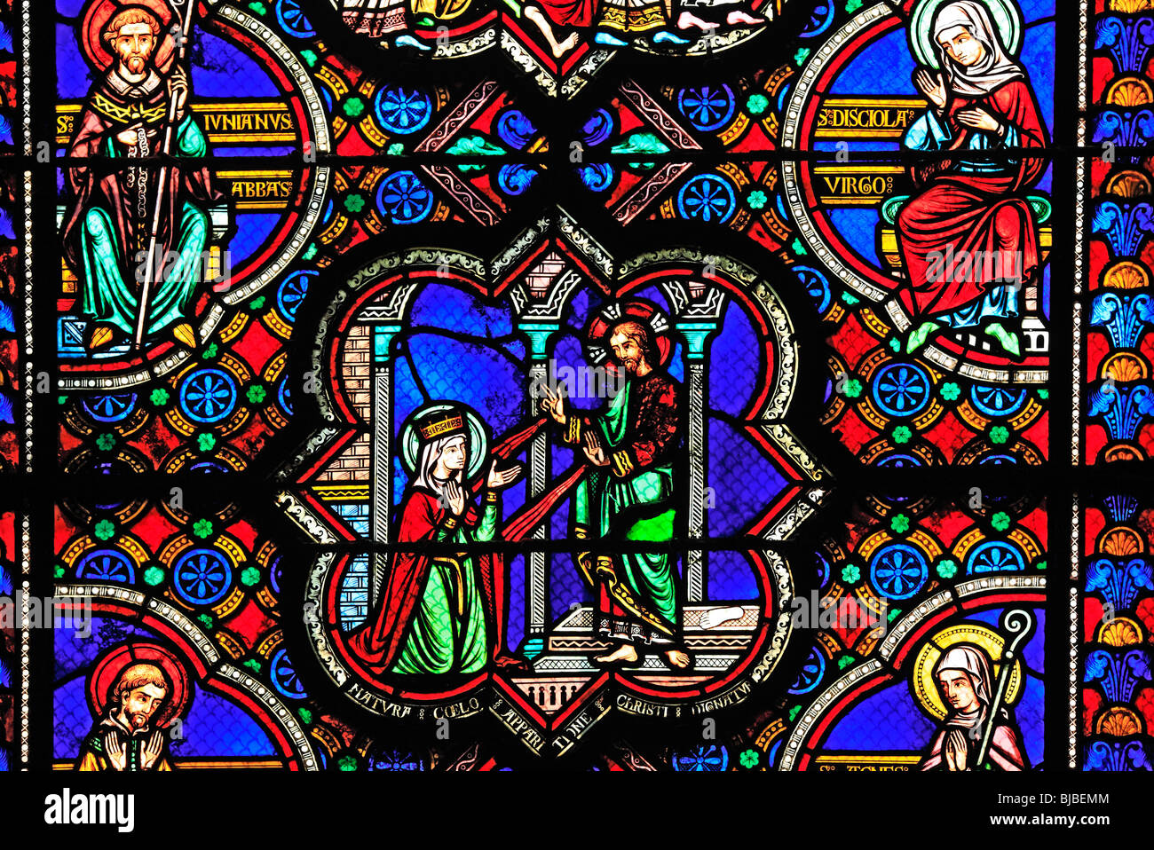 Romanesque coloured stained window, Glass painting in the church Sainte