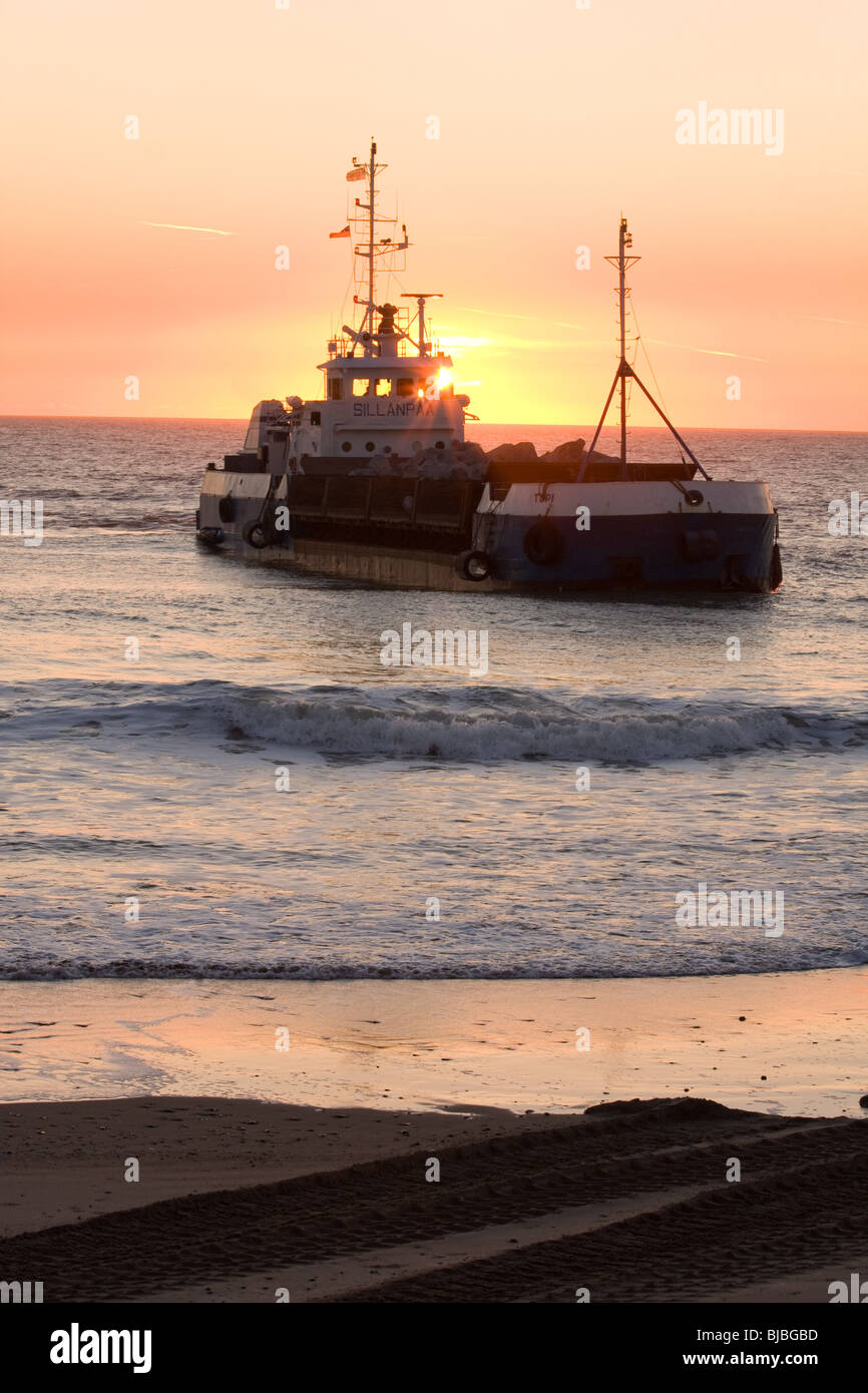 Rock tipper, tywyn, close to the shore Stock Photo
