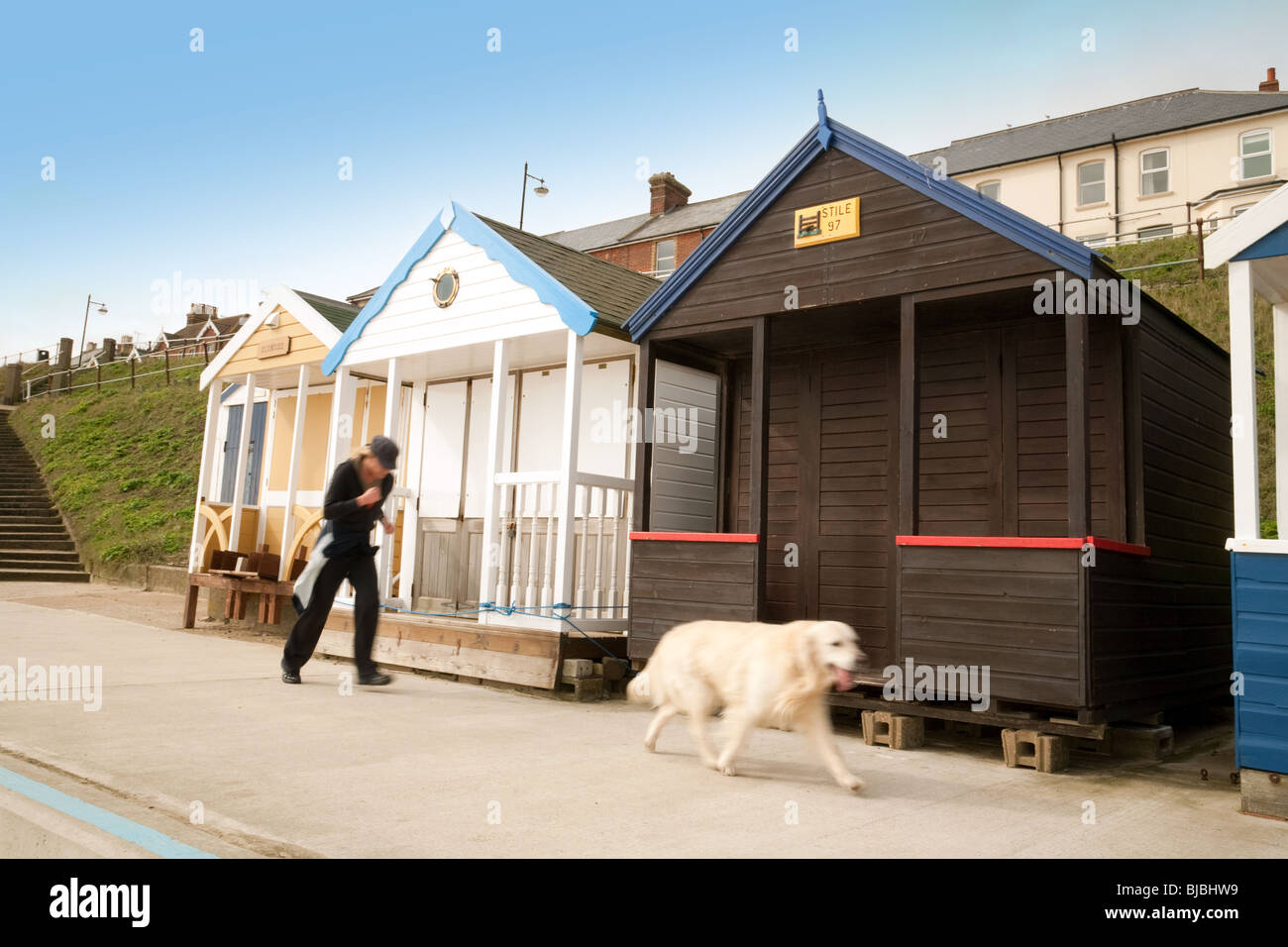 Jogging with the dog, the Promenade, Southwold, Suffolk, UK Stock Photo