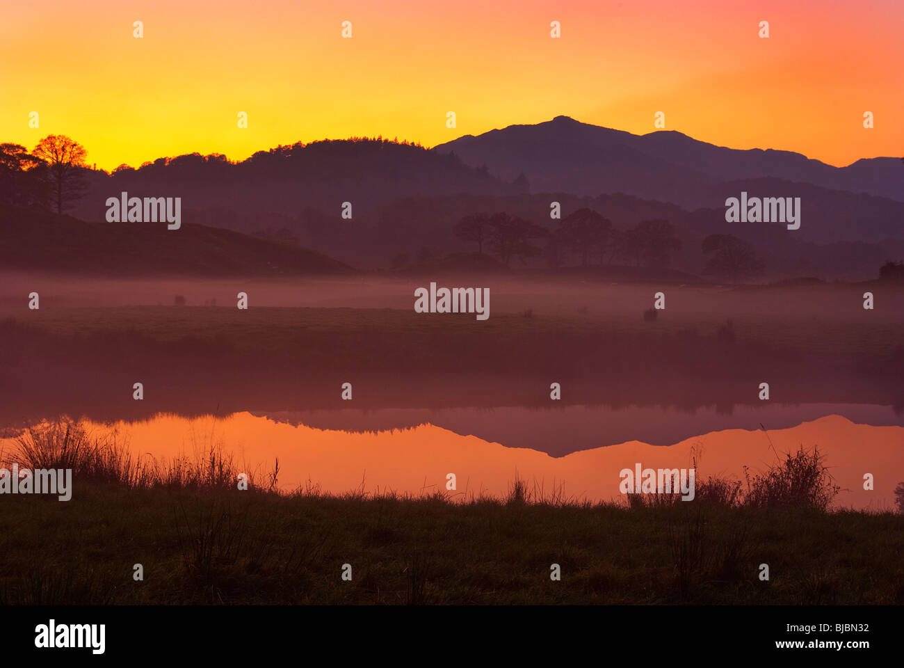 Tranquil lake sunset reflects hi-res stock photography and images - Alamy