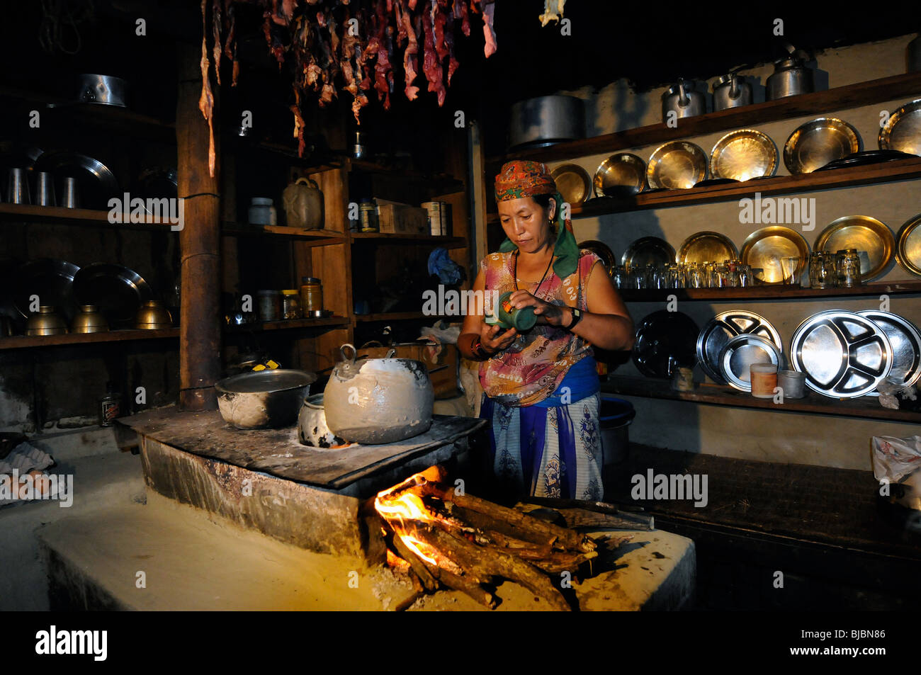 Gurung woman in her kitchen. Stock Photo