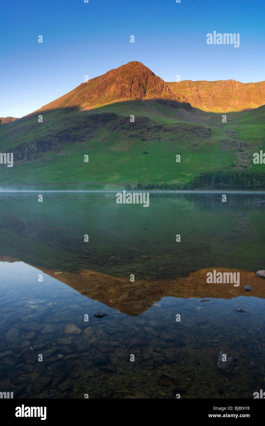 Portrait Image of Lake Buttermere with High Stile reflections Stock Photo