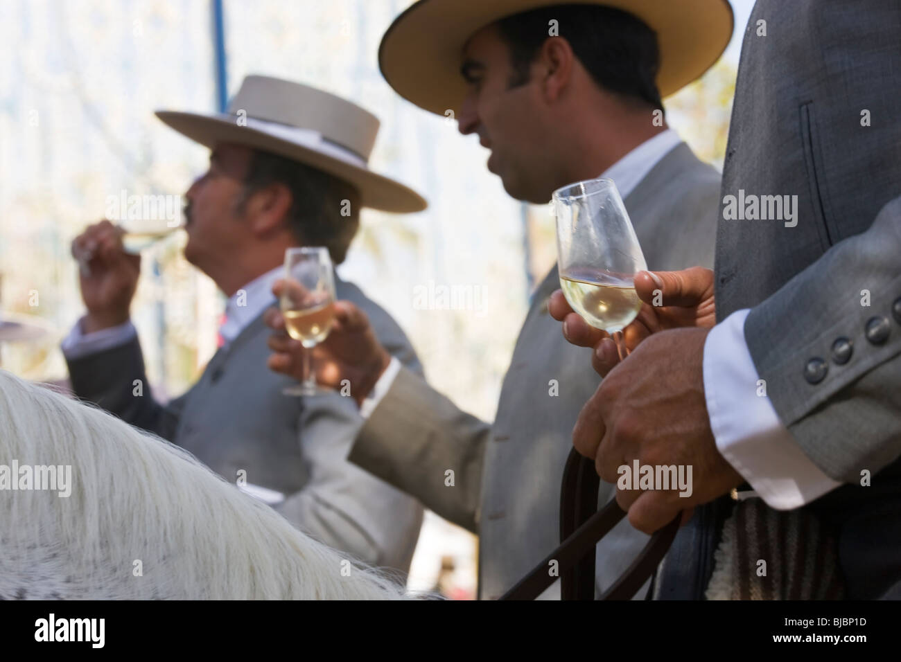 Horsemen drinking sherry, Horse Fair Jerez De La Frontera, Andalucia, Spain Stock Photo