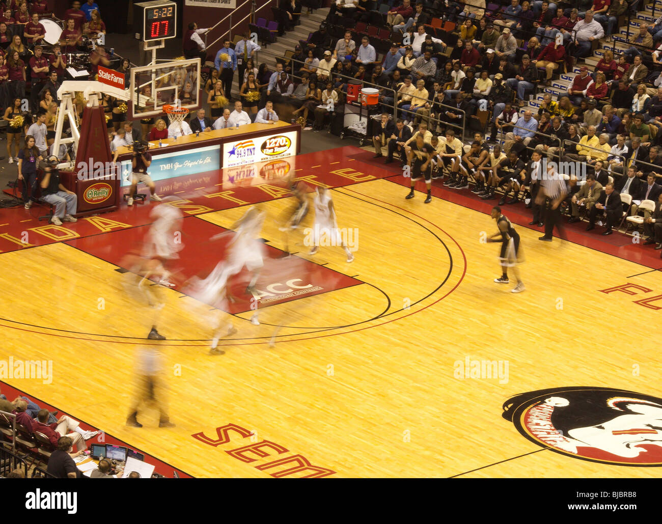 Fast action during basketball game at Florida State University in Tallahassee Stock Photo