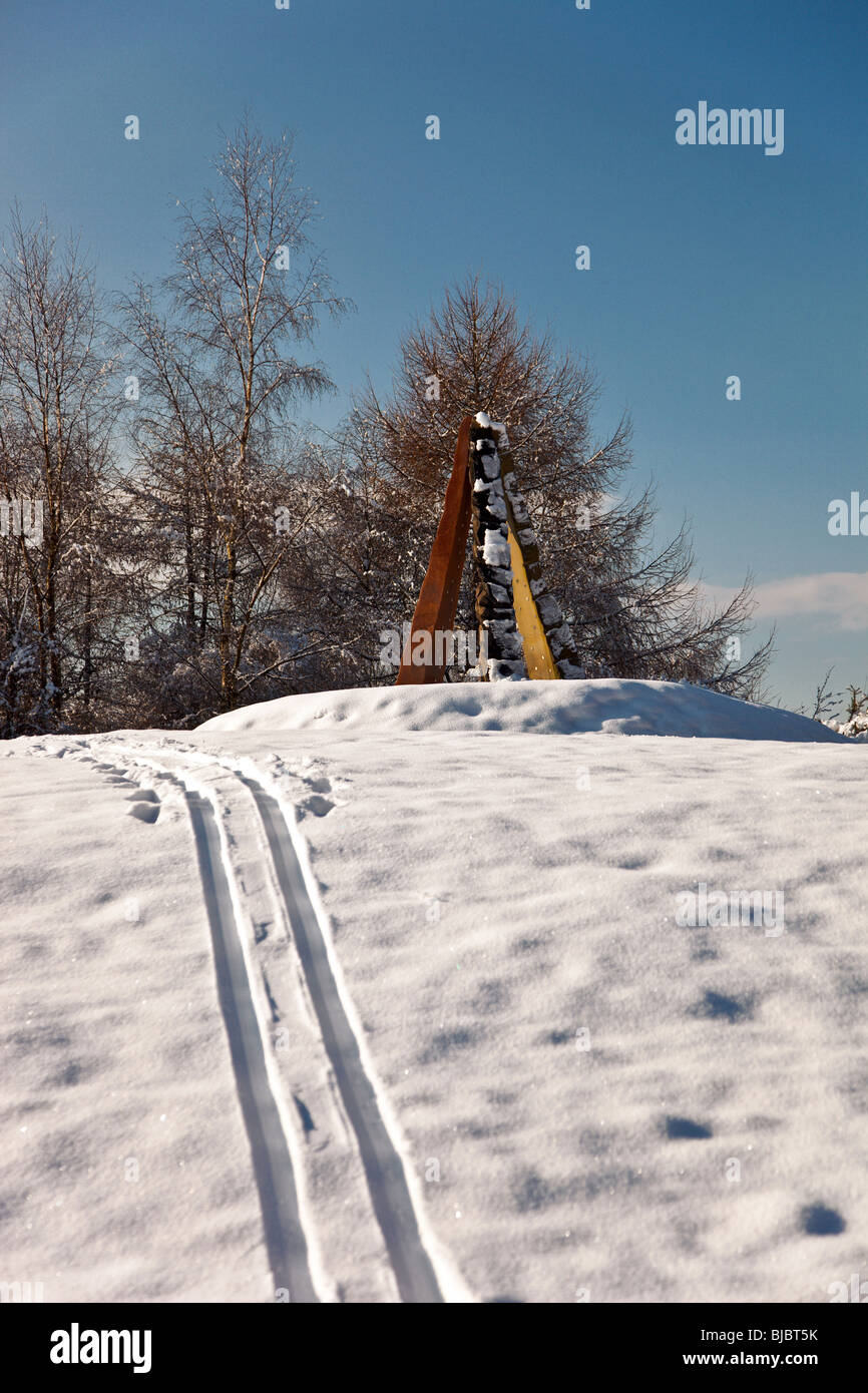 Ski trails in fresh snow at the Roll of Honor sculpture New Fancy View, Forest of Dean , UK Stock Photo