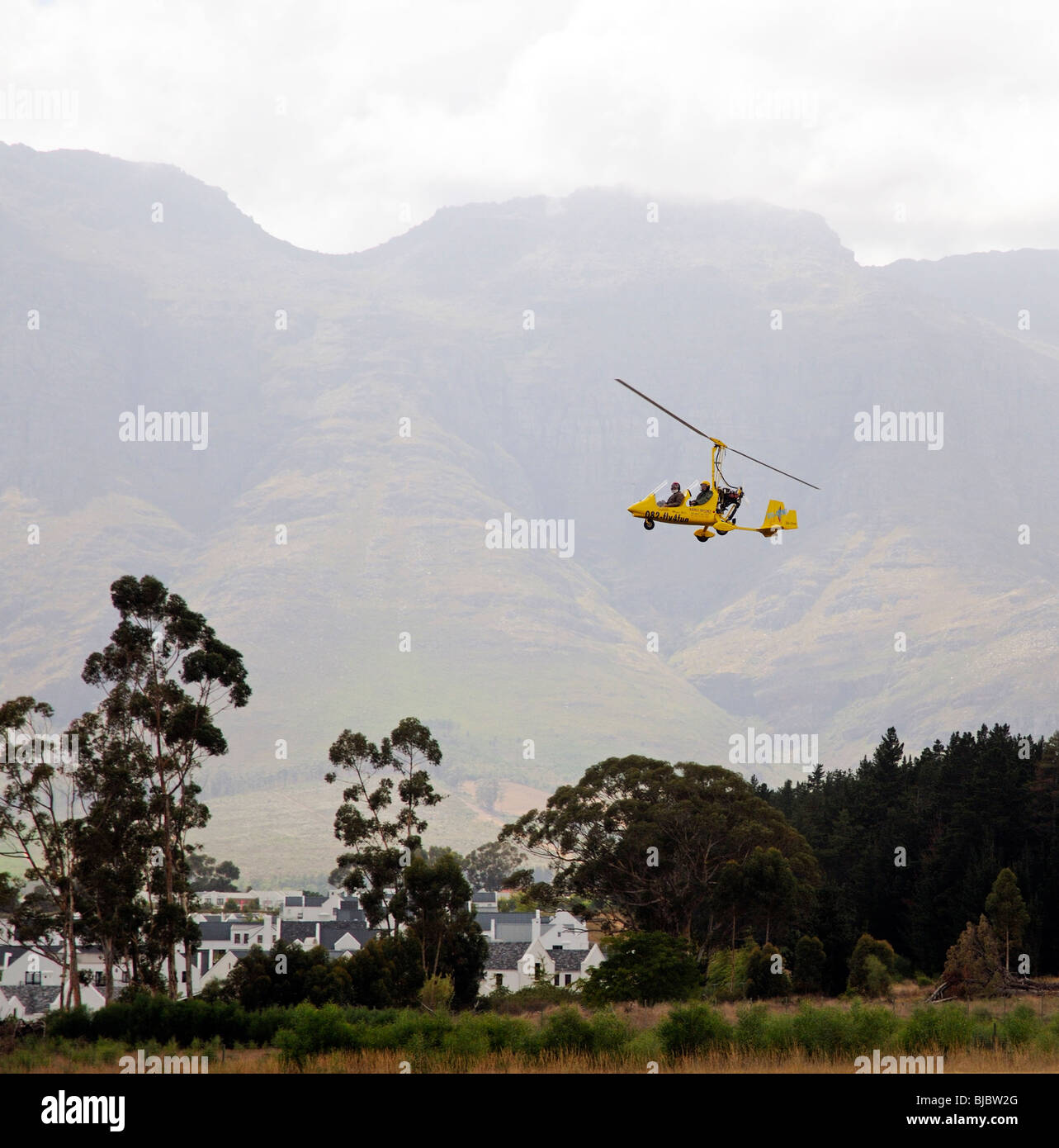 A Magni Gyrocopter tandem trainer aircraft seen flying at Stellenbosch