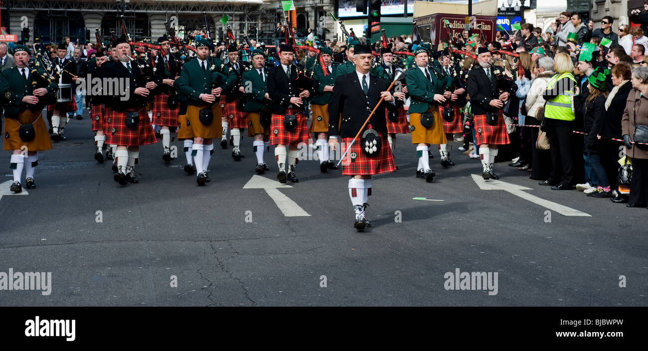 A pipe band marching in the St Patricks Day procession in London. Stock Photo