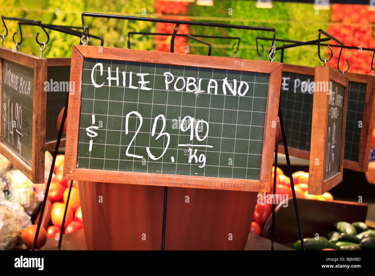 Sign showing the price in Mexican pesos for chile poblano Stock Photo