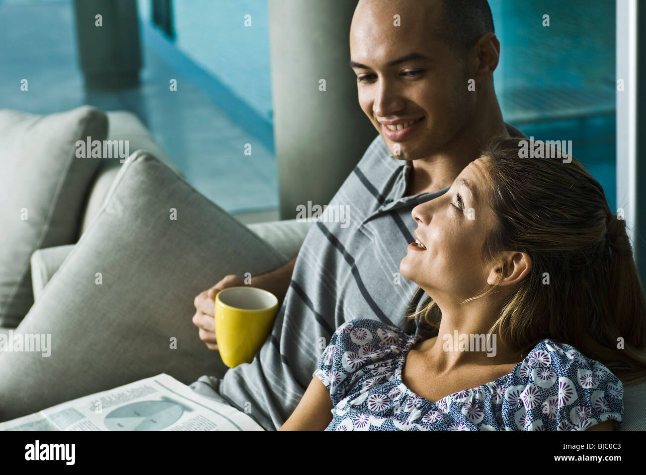 Couple relaxing together at home Stock Photo